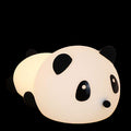 Panda-shaped night light on a wooden surface with color options displayed below.