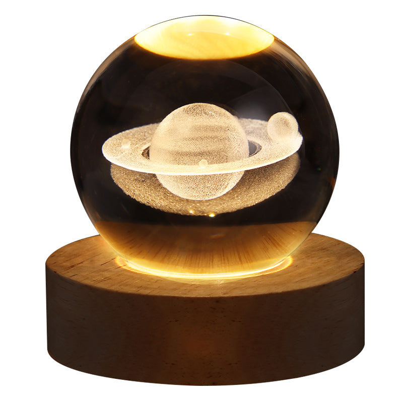 Glowing sphere with a planetary design on a wooden base against a white background